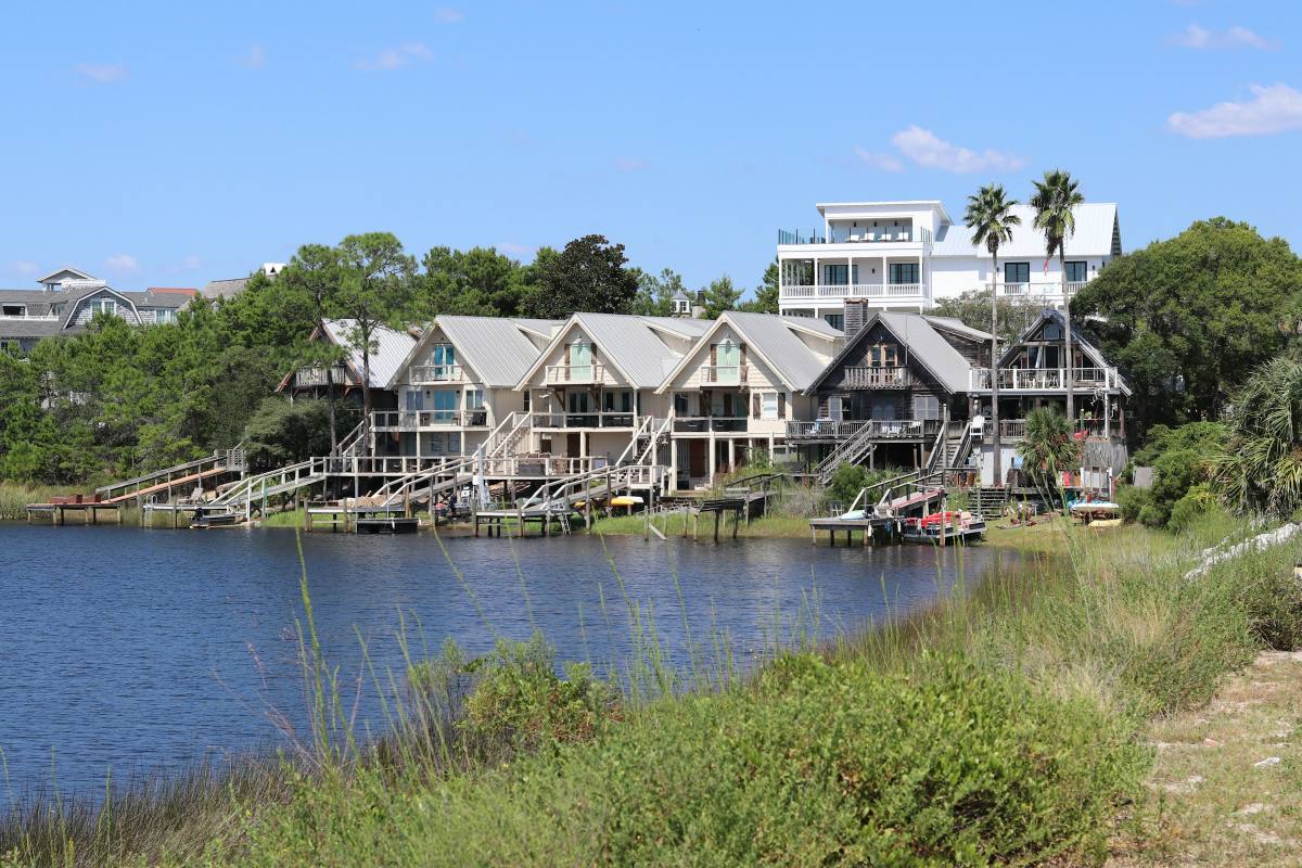Waterfront Southwest Florida homes with private docks and boats along a canal